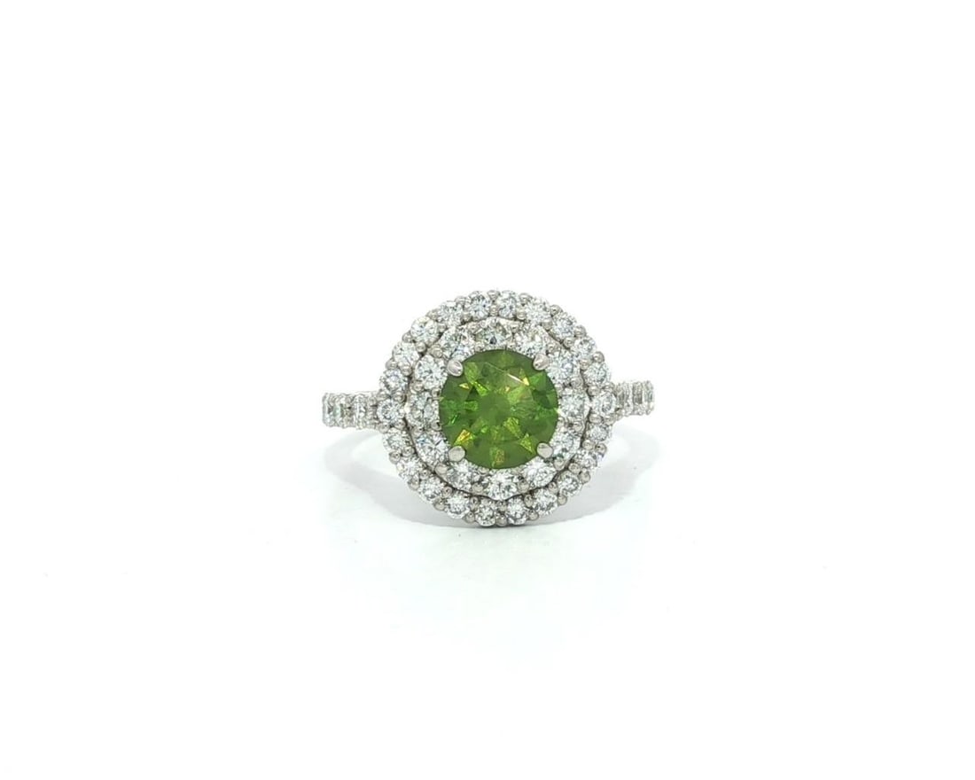 Platinum GRS 2.29ctw Green Demantoid Garnet Diamond Double Halo Ring: Platinum GRS 2.29ctw Green Demantoid Garnet Diamond Double Halo Ring This exquisite double halo ring features a stunning 2.29ctw of vibrant horsetail green demantoid garnet and diamonds, expertly craf
