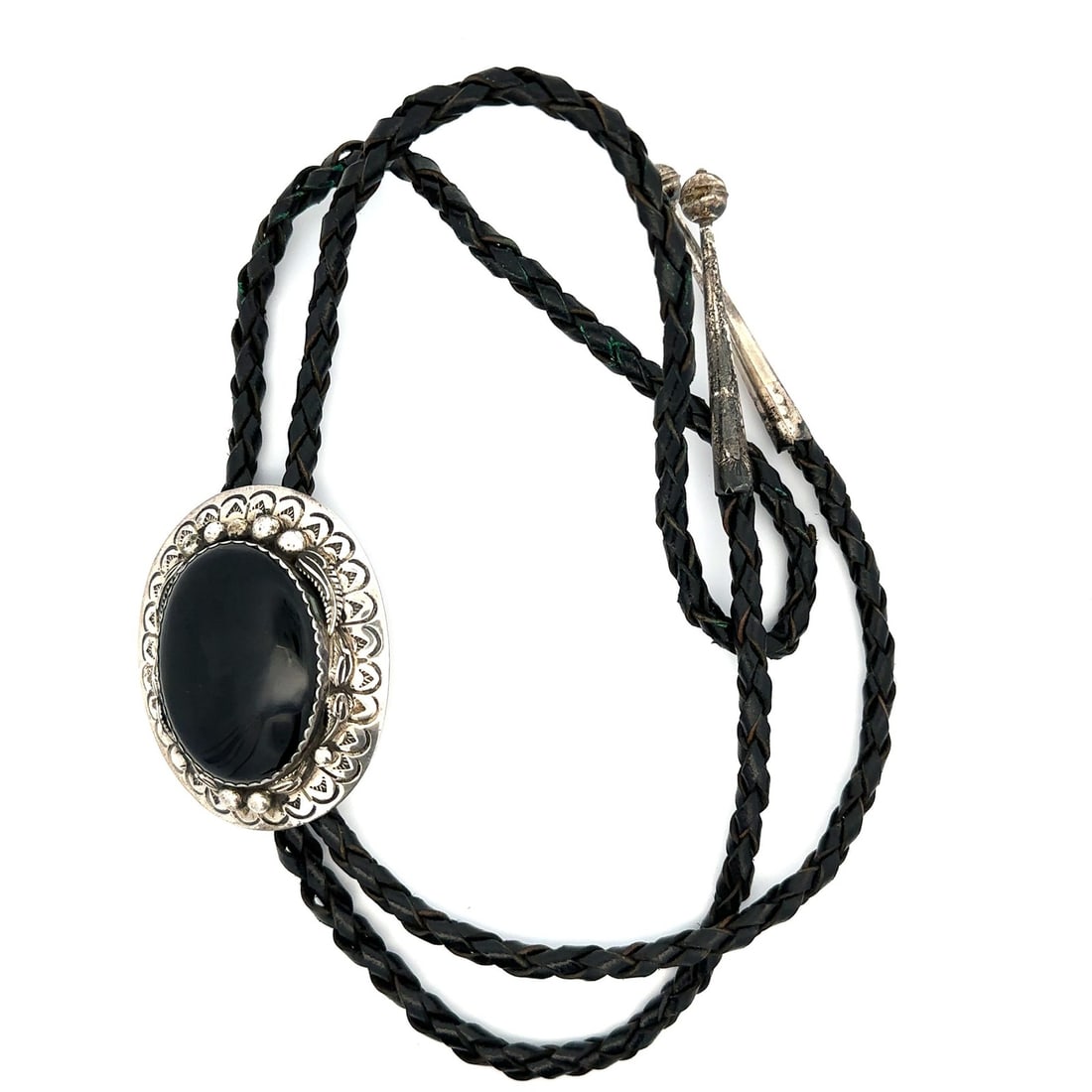 Handcrafted Sterling Silver Black Onyx Cabochon Bolo Tie with Leather Cord: Handcrafted Sterling Silver Black Onyx Cabochon Bolo Tie with Leather Cord This vintage bolo tie features a handmade design crafted from sterling silver and black leather. The centerpiece is an oval c