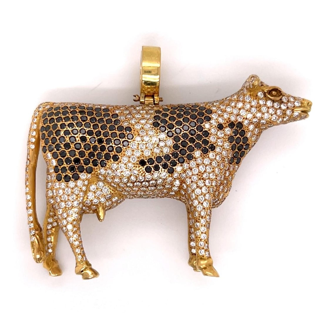 Cow Pendant in 18K Yellow Gold with White and Black Diamonds 2.25 Inch: Cow Pendant in 18K Yellow Gold with White and Black Diamonds 2.25 Inch This pendant is crafted in 18K yellow gold and features a cow design set with approximately 9.00 carats of white diamonds in F-G 