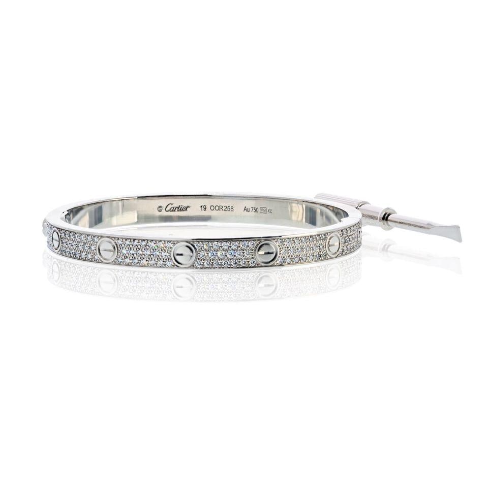 Cartier Love Bracelet 18K White Gold Pave Diamonds Size 19: Cartier Love Bracelet 18K White Gold Pave Diamonds Size 19 This exquisite pre-owned Cartier Love bracelet showcases the iconic design in luxurious 18K white gold, adorned with pave set brilliant round