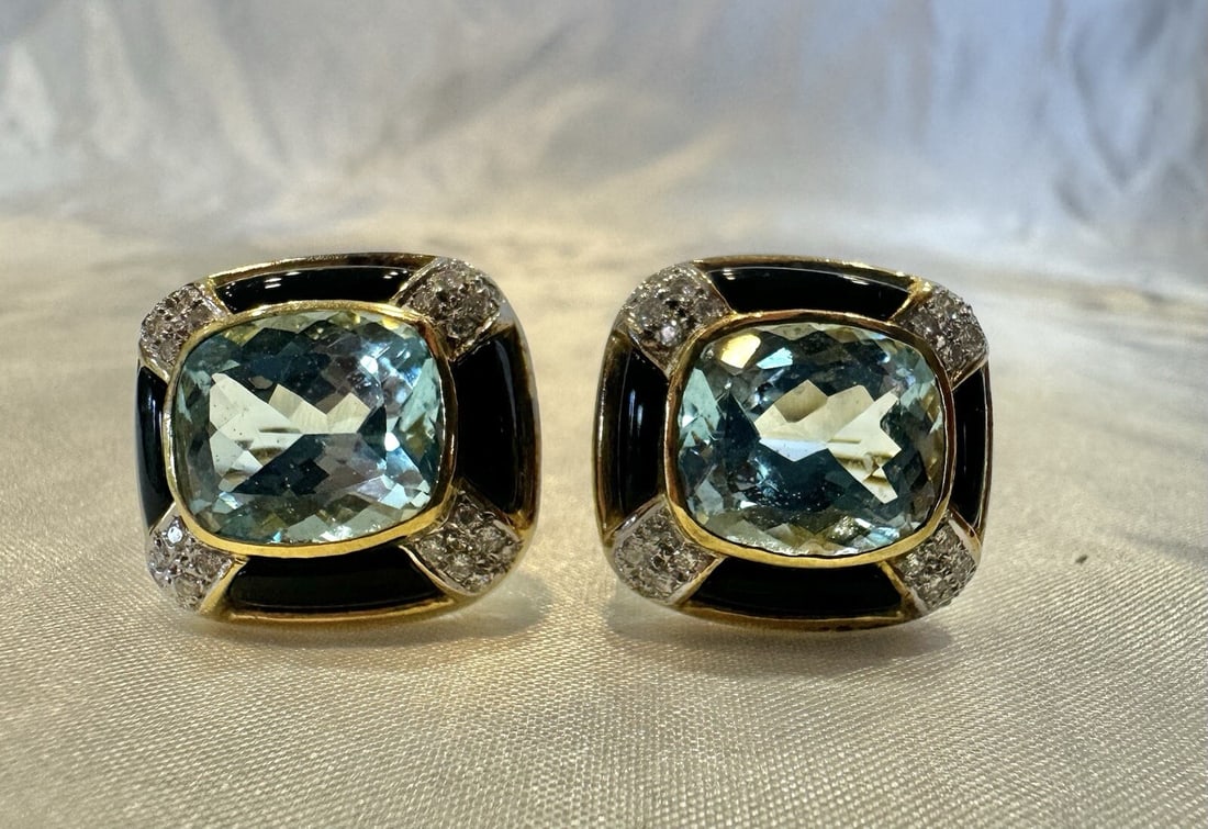 French 18K Yellow Gold Topaz Onyx Diamond Earrings Pair: French 18K Yellow Gold Topaz Onyx Diamond Earrings Pair This exquisite French pair of 18K yellow gold earrings features a striking combination of blue topaz, diamonds, and black onyx. The earrings are