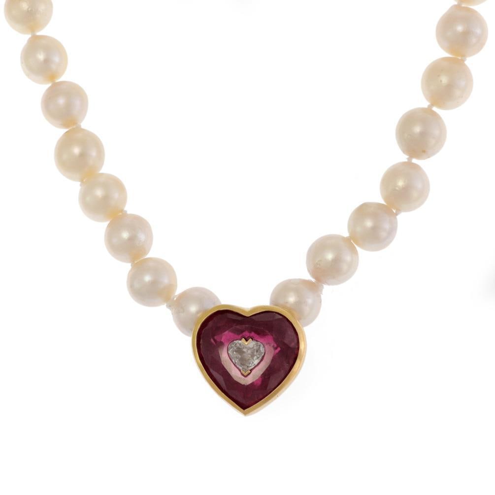 Vintage 18k 14k Gold Necklace with Pink Tourmaline and Diamond: Vintage 18k 14k Gold Necklace with Pink Tourmaline and Diamond This exquisite vintage necklace showcases a stunning combination of pearls and gold. The necklace is beautifully designed with a 14k yell