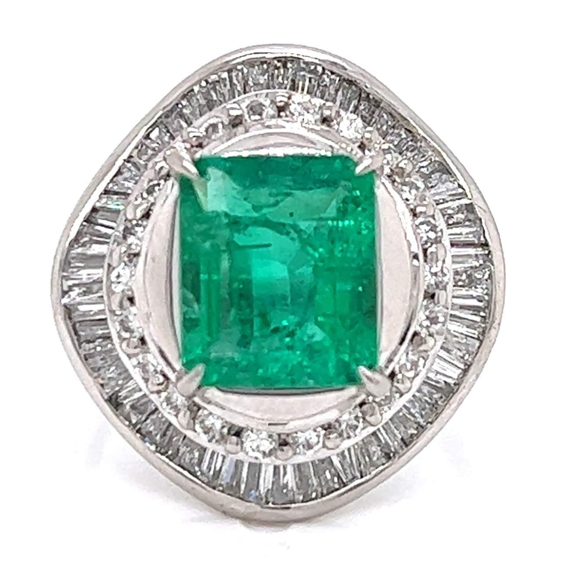 Stunning Platinum Emerald 2.18 Ct Diamond Ring F-H VS1-SI1: Stunning Platinum Emerald 2.18 Ct Diamond Ring F-H VS1-SI1 This exquisite Platinum Emerald and Diamond Ring features a stunning 2.18 Ct. center emerald, elegantly framed by 1.04 Ct. of brilliant diamo