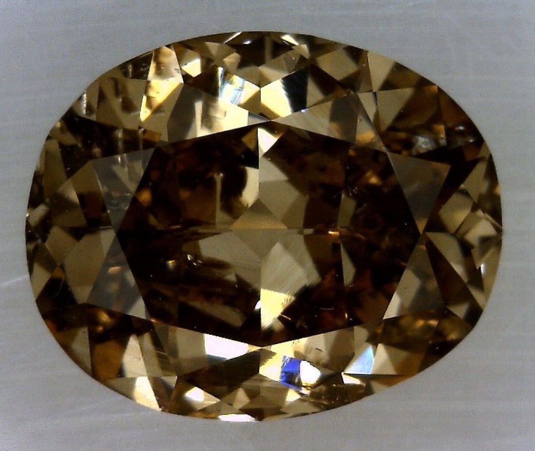 Loose Diamond - OVAL 0.71ct Fancy Dark Yellowish Brown: Loose Diamond - OVAL 0.71ct Fancy Dark Yellowish Brown Source: Natural Shape: OVAL Carats: 0.71 Color: Fancy Dark Yellowish Brown Certification: GIA The Diamond Depot Guarantee: All items in this auct