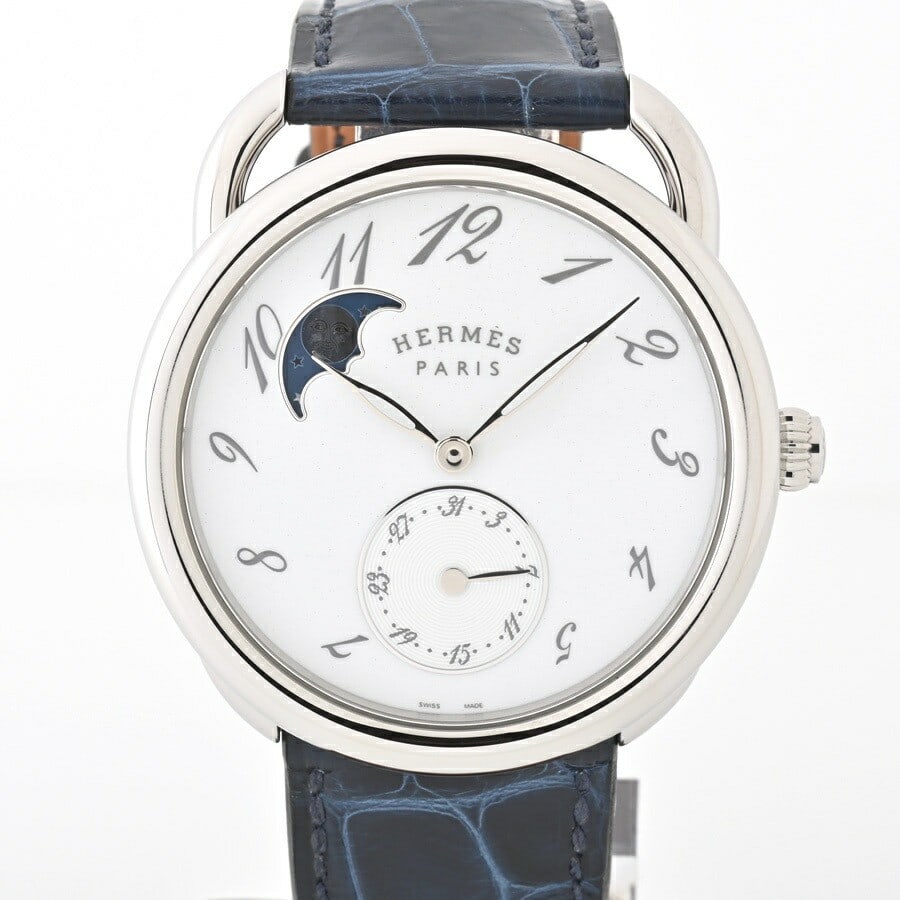 Hermes Arceau Petite Lune AR7M.510 Automatic Moon Phase Watch White Dial: Hermes Arceau Petite Lune AR7M.510 Automatic Moon Phase Watch White Dial This Hermes Arceau Petite Lune AR7M.510 is a sophisticated men's wristwatch featuring a round stainless steel case and a white 