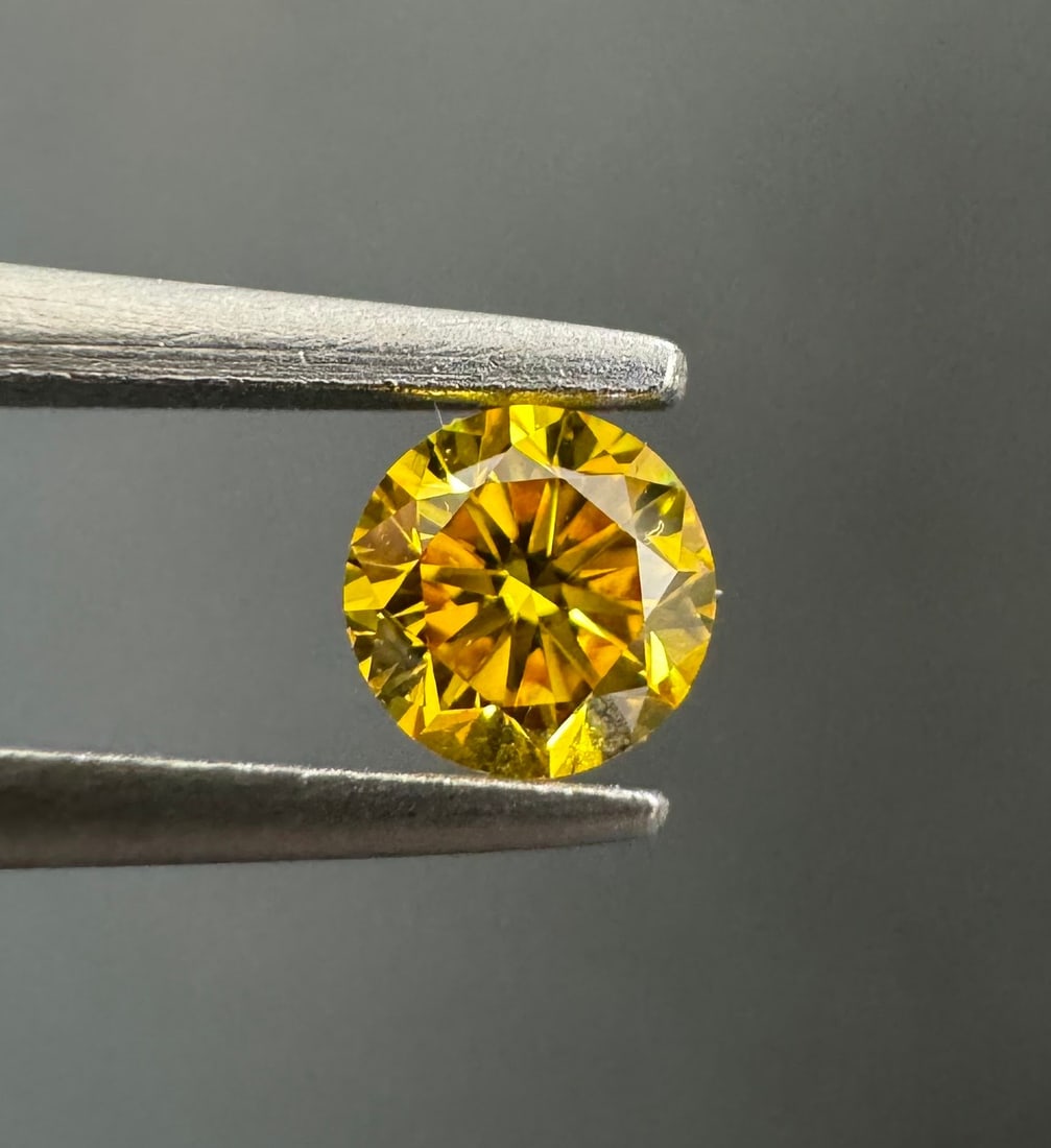 Loose Diamond - ROUND 0.24ct Fancy Vivid Orangey Yellow I1: Loose Diamond - ROUND 0.24ct Fancy Vivid Orangey Yellow I1 Source: Natural Shape: ROUND Carats: 0.24 Color: Fancy Vivid Orangey Yellow Certification: GIA Video: