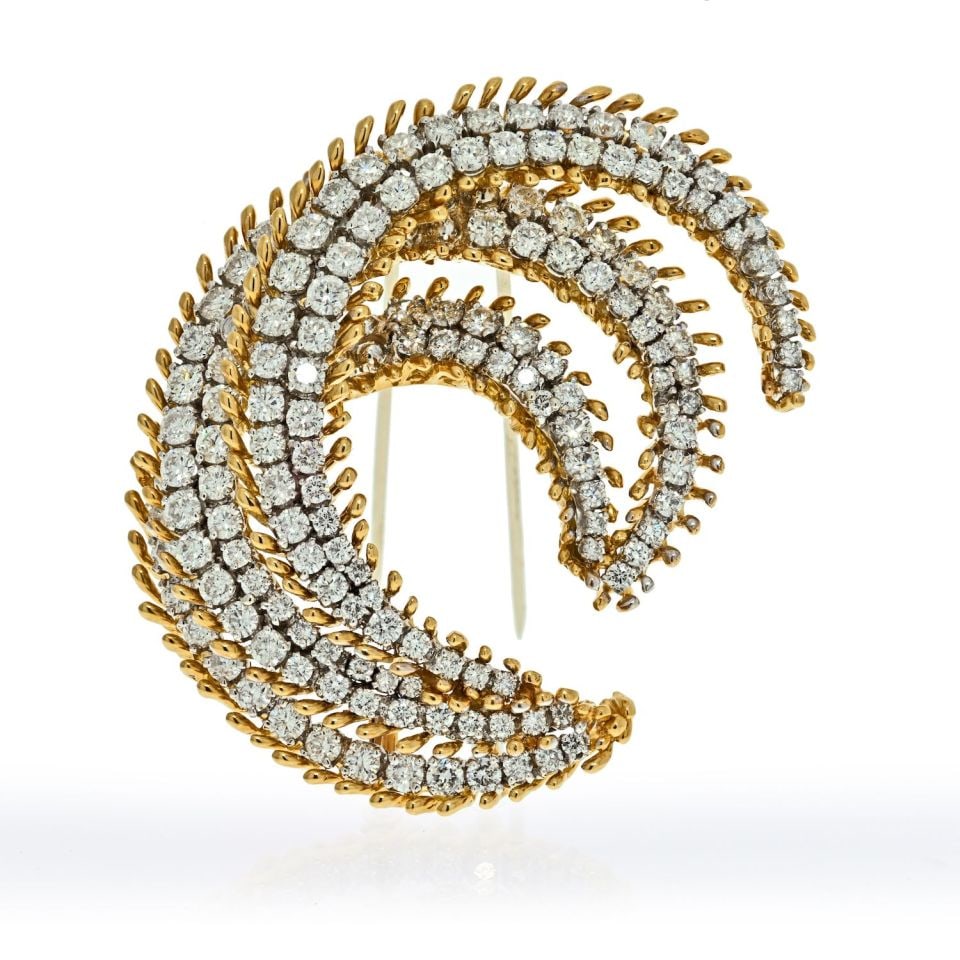 Platinum and 18K Gold Crescent Brooch with 12 Carats Diamonds by David Webb: Platinum and 18K Gold Crescent Brooch with 12 Carats Diamonds by David Webb This elegant brooch by David Webb features a swirl crescent motif, expertly crafted from platinum and 18K yellow gold. Set w
