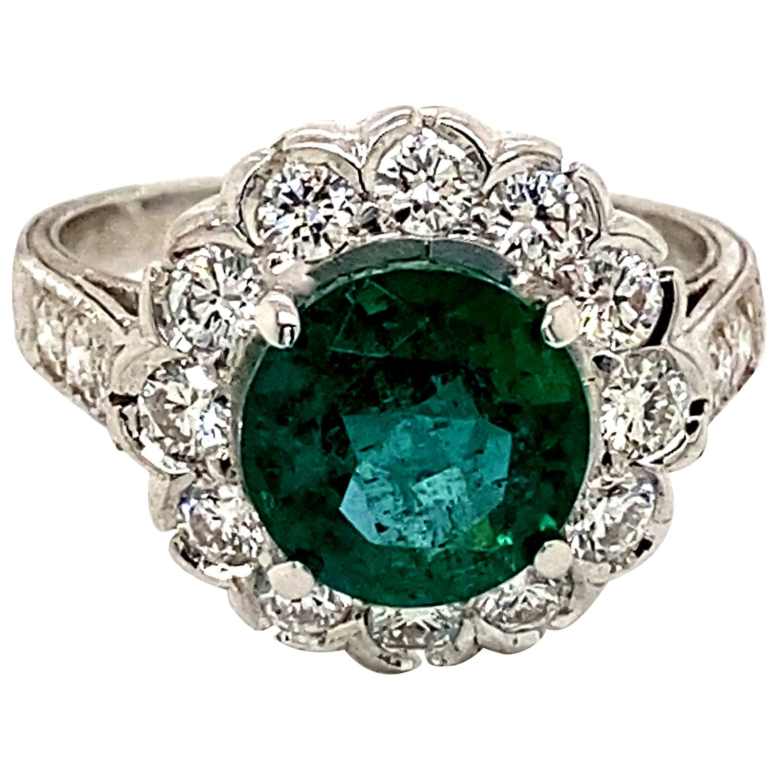 Art Deco 2.47ct Emerald Diamond Halo Ring 18k White Gold: Art Deco 2.47ct Emerald Diamond Halo Ring 18k White Gold This stunning Art Deco inspired ring showcases a vibrant 2.47ct round emerald elegantly framed by a halo of 18 round brilliant diamonds, totali
