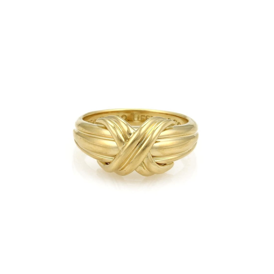 Signature X Collection 18k Yellow Gold Crossover Ring by Tiffany & Co.: Signature X Collection 18k Yellow Gold Crossover Ring by Tiffany & Co. This authentic Tiffany & Co. Signature X Crossover ring features an elegant grooved shank crafted in 18k yellow gold with a polis