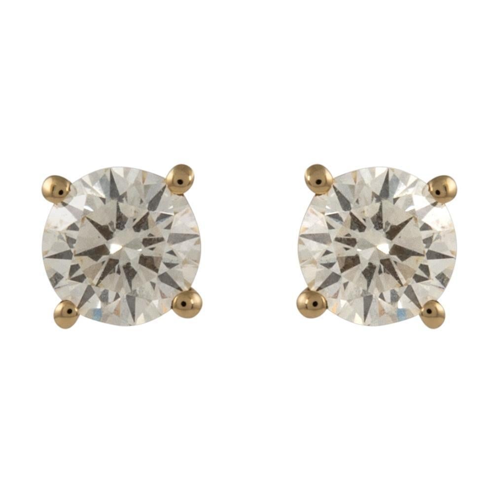 1.06ct Round Diamond Stud Earrings in 18k Yellow Gold with GIA Appraisal: 1.06ct Round Diamond Stud Earrings in 18k Yellow Gold with GIA Appraisal These exquisite diamond stud earrings feature two matching round brilliant diamonds totaling 1.06 carats. Crafted from 18k yell