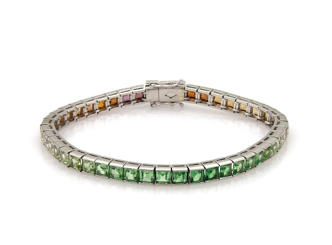 Unbranded Rainbow Tennis Bracelet Platinum 13.31ct Multicolor Gemstones: Unbranded Rainbow Tennis Bracelet Platinum 13.31ct Multicolor Gemstones This vintage estate rainbow gemstone tennis bracelet is crafted in platinum and features multicolor gemstones arranged in a squa