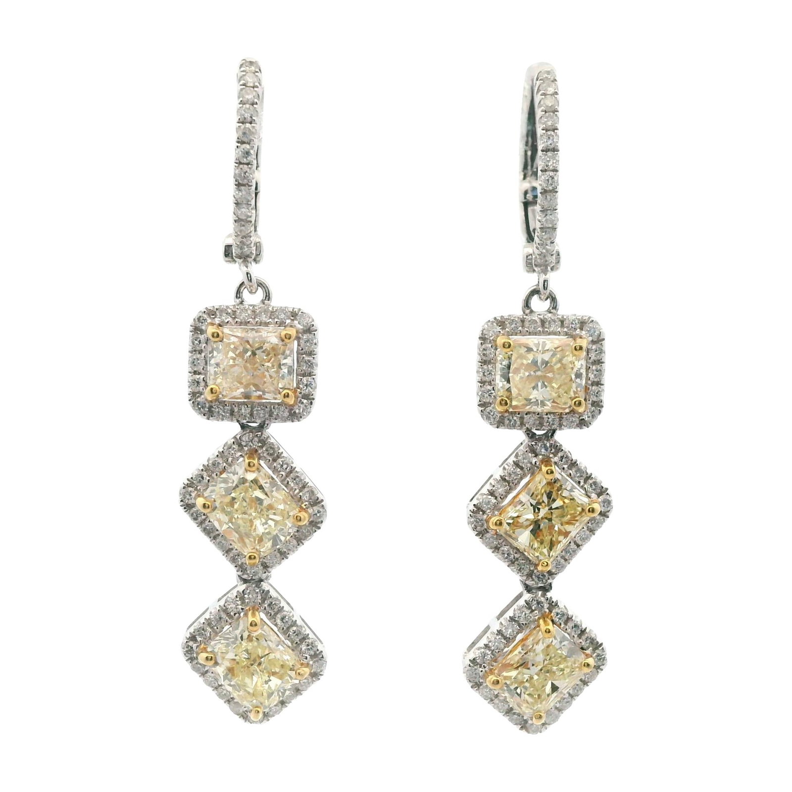 3.93ct Yellow Diamond Dangle Halo Earrings 18k Gold: 3.93ct Yellow Diamond Dangle Halo Earrings 18k Gold Exquisite and contemporary, these dangle earrings feature a stunning arrangement of natural yellow diamonds surrounded by a halo of brilliant white 