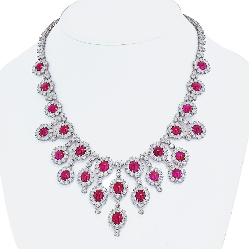 Platinum Necklace with 24 Oval Cut Rubies and 52 Carats Diamonds: Platinum Necklace with 24 Oval Cut Rubies and 52 Carats Diamonds This exquisite Platinum Ruby & Diamond Collar Necklace features a stunning arrangement of 24 oval cut rubies and brilliant cut diamonds