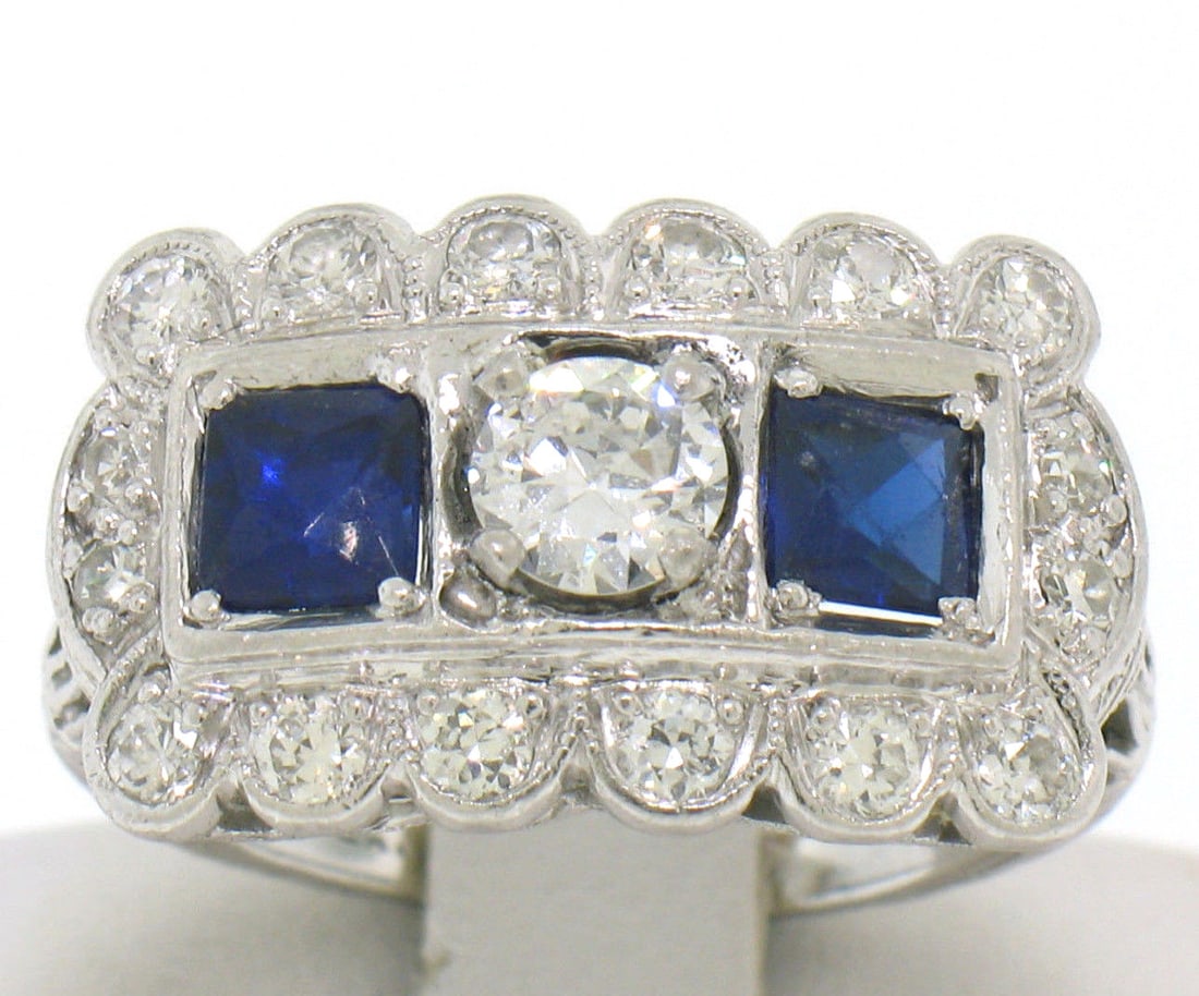 Art Deco Platinum Ring with European Cut Diamonds and Synthetic Sapphires: Art Deco Platinum Ring with European Cut Diamonds and Synthetic Sapphires This antique Art Deco ring features intricate etching on solid platinum and showcases a total of 1.00 carat of old European cu