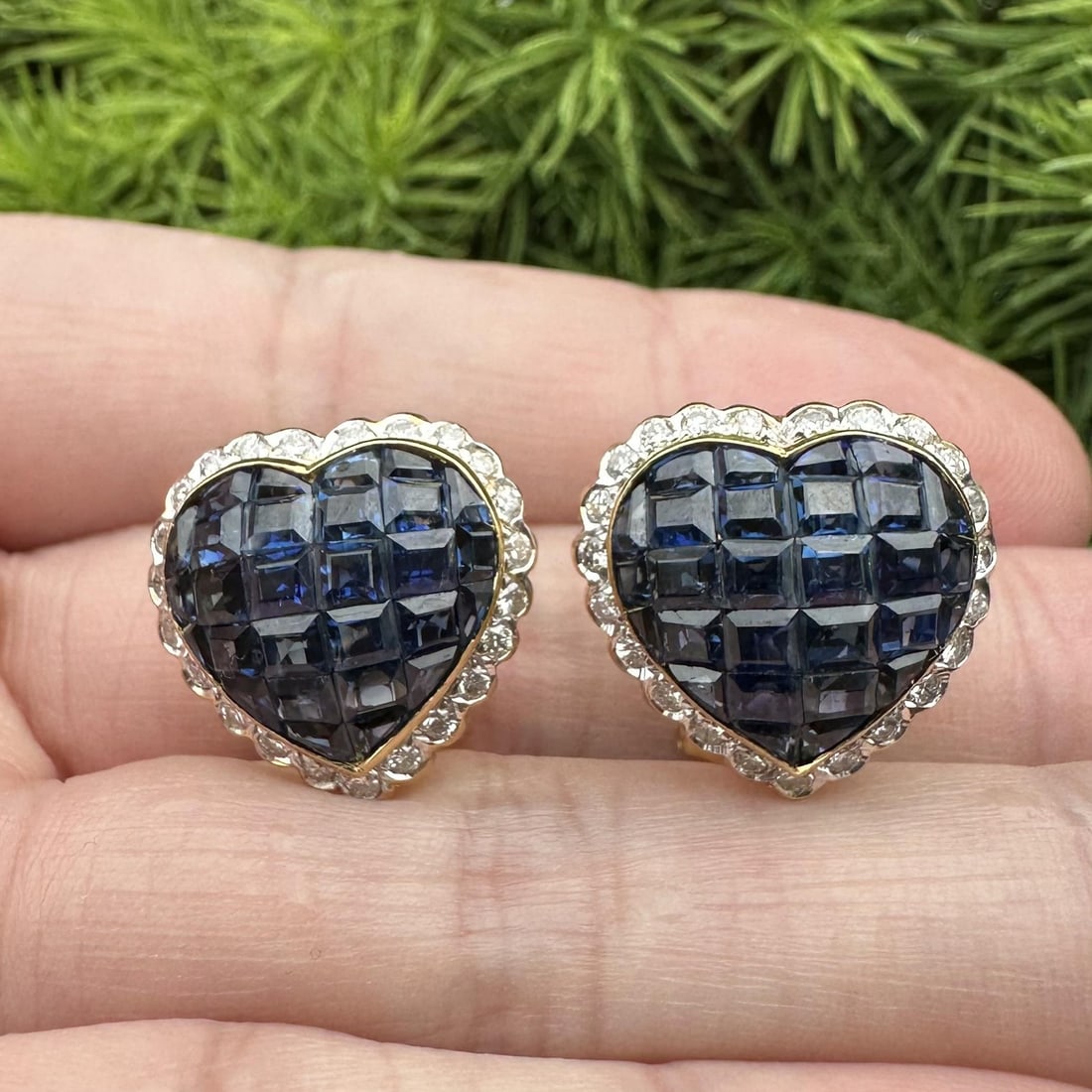 Omega 18k gold heart earrings sapphire diamond invisible set: Omega 18k gold heart earrings sapphire diamond invisible set These elegant earrings feature a heart-shaped design crafted from solid 18k yellow and white gold. They are set with approximately 6.0 cara