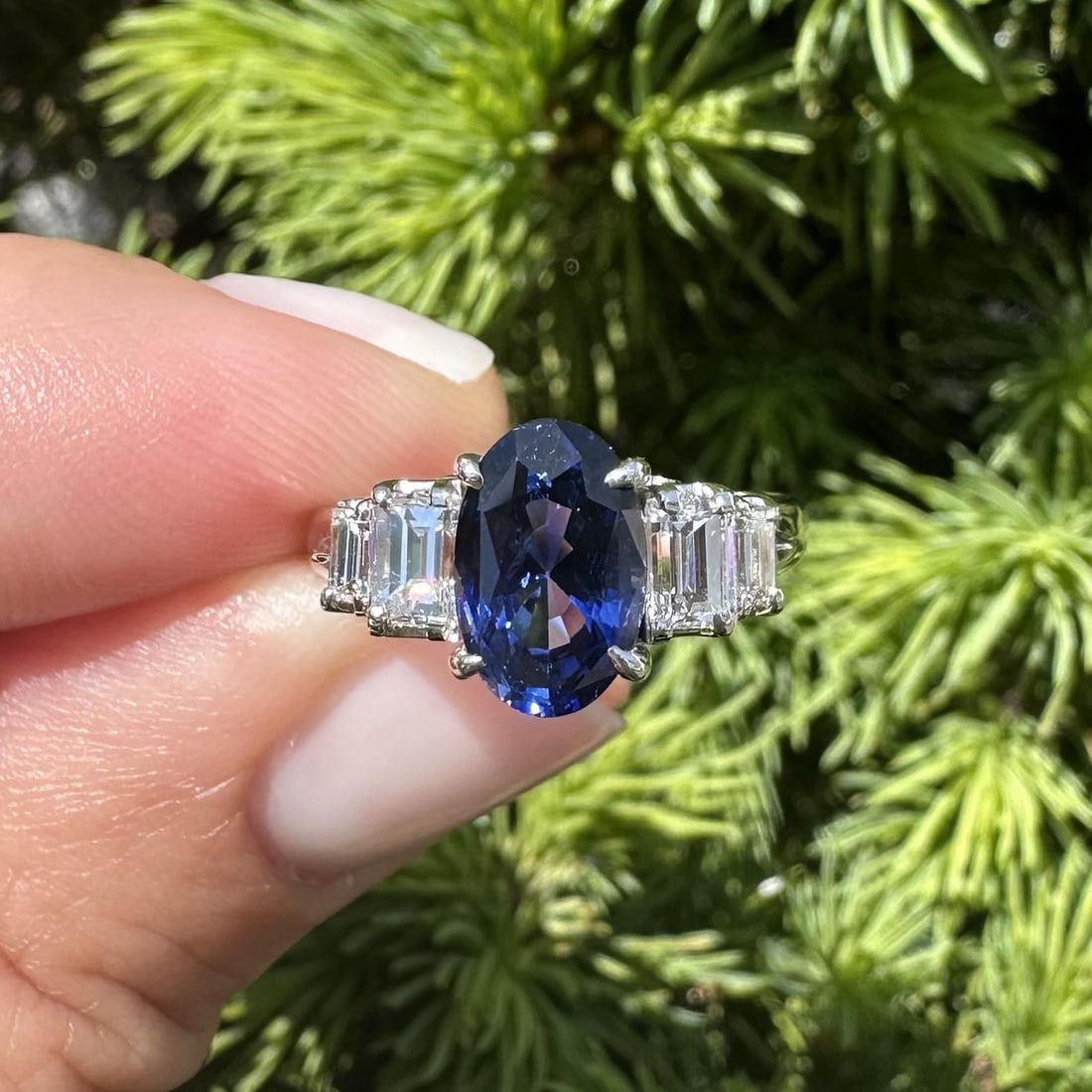 Platinum Sapphire Ring with GIA Certification and Diamond Baguettes: Platinum Sapphire Ring with GIA Certification and Diamond Baguettes This vintage platinum cocktail ring features a natural elongated oval sapphire as its centerpiece, weighing exactly 2.01 carats