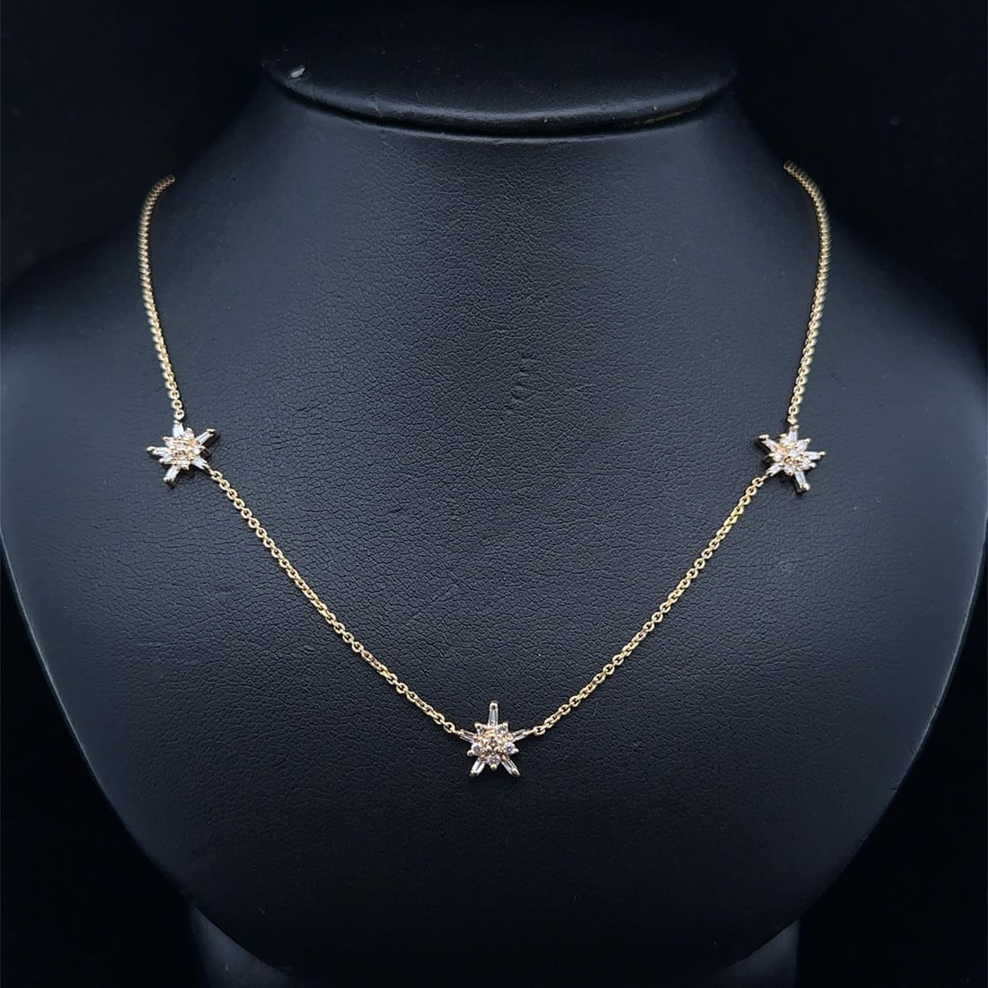 Diamond Star Cluster Necklace in 14k Yellow Gold 0.35ctw Station Style: Diamond Star Cluster Necklace in 14k Yellow Gold 0.35ctw Station Style This necklace features a cluster star snowflake station design crafted in solid 14k yellow gold. Adorned with approximately 0.35 