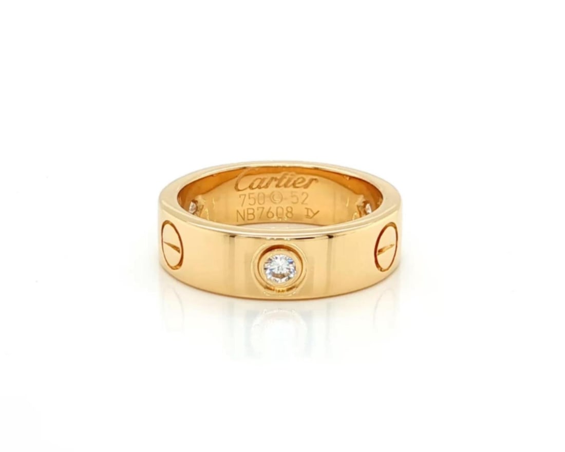 Cartier LOVE 18k Yellow Gold Ring 3 Diamond Band Size 52 US 6: Cartier LOVE 18k Yellow Gold Ring 3 Diamond Band Size 52 US 6 This pre-owned Cartier LOVE band ring is crafted in 18k yellow gold and features the iconic screw motif with three round diamonds totaling