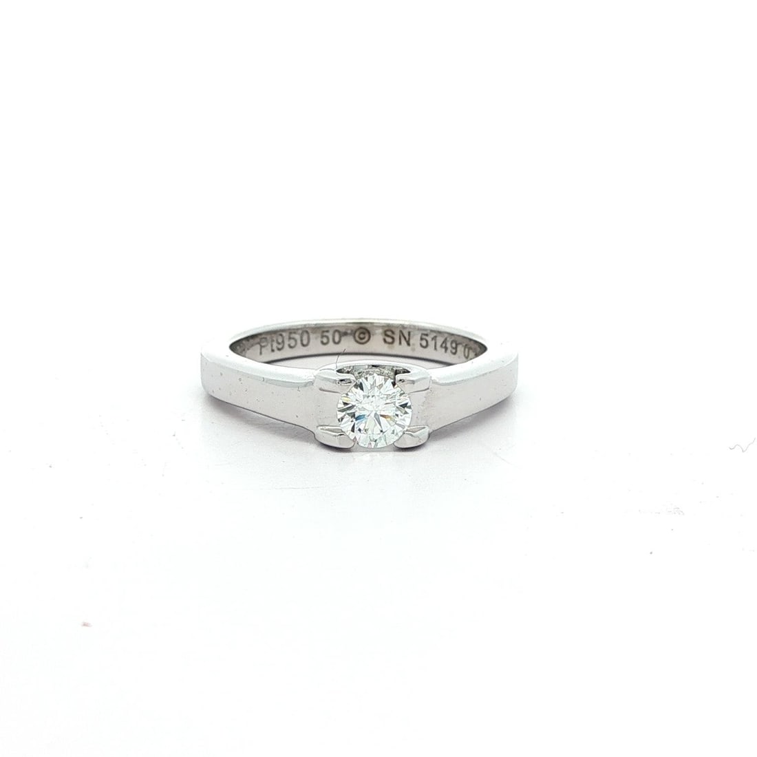 Cartier Platinum .30ct F VVS2 Diamond Solitaire Engagement Ring with Box: Cartier Platinum .30ct F VVS2 Diamond Solitaire Engagement Ring with Box This exquisite C De Cartier engagement ring showcases a stunning natural diamond. Featuring a round brilliant cut, the diamond 