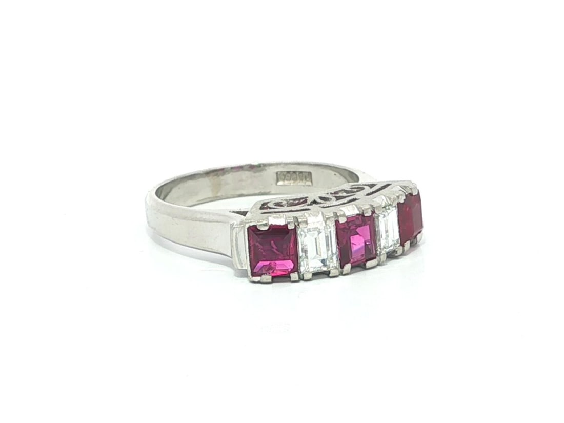 Platinum Band Ring with Step Cut Natural Ruby and Diamond Accents Size 4.5: Platinum Band Ring with Step Cut Natural Ruby and Diamond Accents Size 4.5 This vintage platinum band ring features a striking combination of three natural step cut rubies and two natural step cut dia