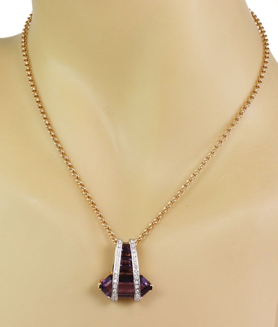 Vintage 18k Gold Platinum Amethyst Diamond Pendant Necklace: Vintage 18k Gold Platinum Amethyst Diamond Pendant Necklace This vintage estate pendant necklace is crafted in 18k yellow gold with platinum accents and features an amethyst geometric pendant design w