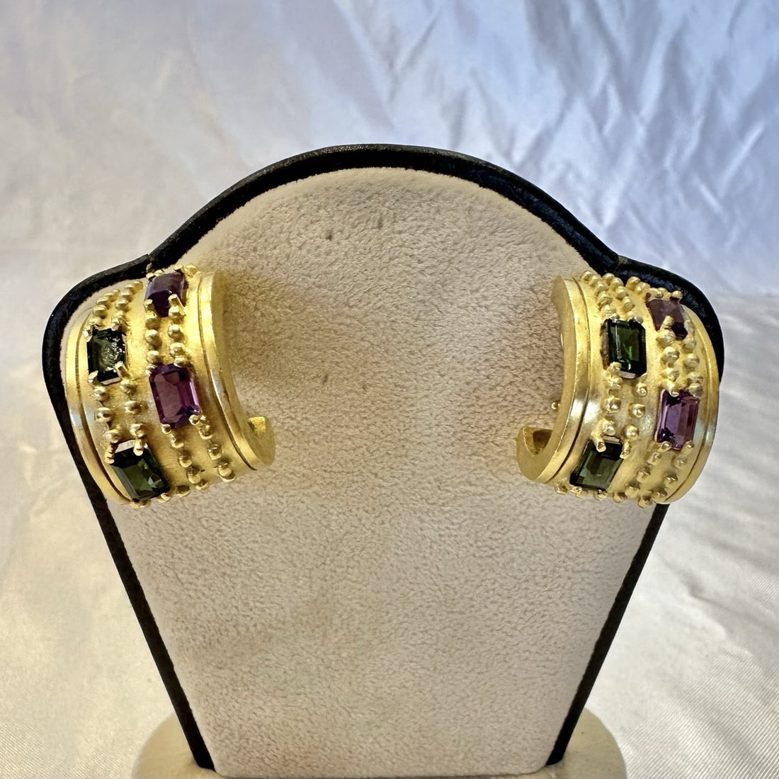 Greek 18K Yellow Gold Amethyst Tourmaline Earrings Pair: Greek 18K Yellow Gold Amethyst Tourmaline Earrings Pair This exquisite pair of Greek earrings showcases the beauty of 18K yellow gold, expertly crafted with intricate details and design. Each earring 