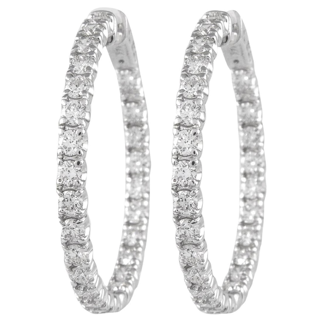4.24ct Diamond Hoop Earrings in 14k White Gold: 4.24ct Diamond Hoop Earrings in 14k White Gold Elevate your elegance with these stunning 4.24ct Diamond Hoop Earrings, crafted from luxurious 14k white gold. Featuring 52 round brilliant diamonds, the