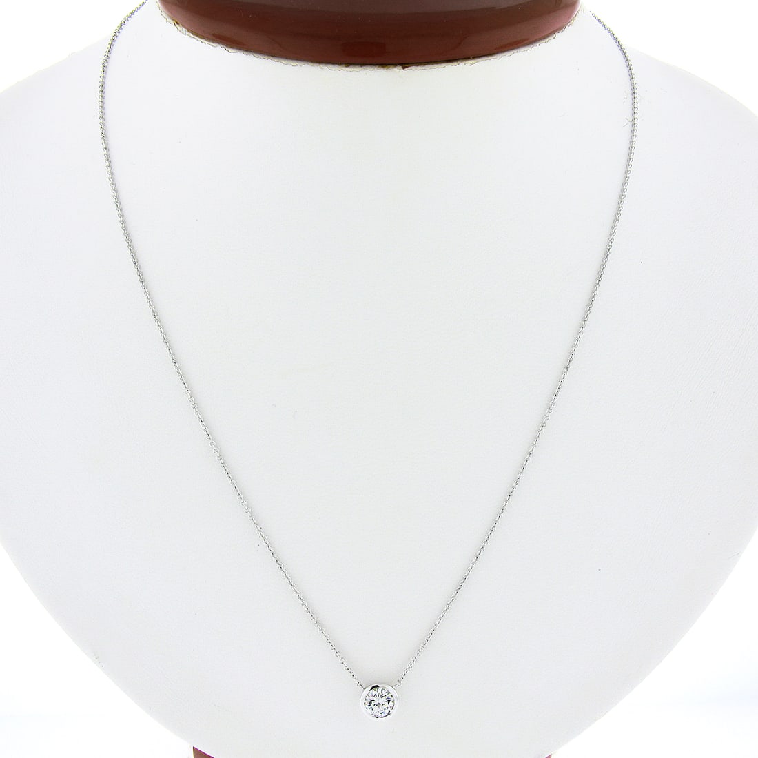 Elegant 14k White Gold 0.55ct Diamond Bezel Pendant with Adjustable Chain: Elegant 14k White Gold 0.55ct Diamond Bezel Pendant with Adjustable Chain This exquisite pendant features a round brilliant cut diamond, securely set in a sleek bezel design. Crafted from solid 14k wh