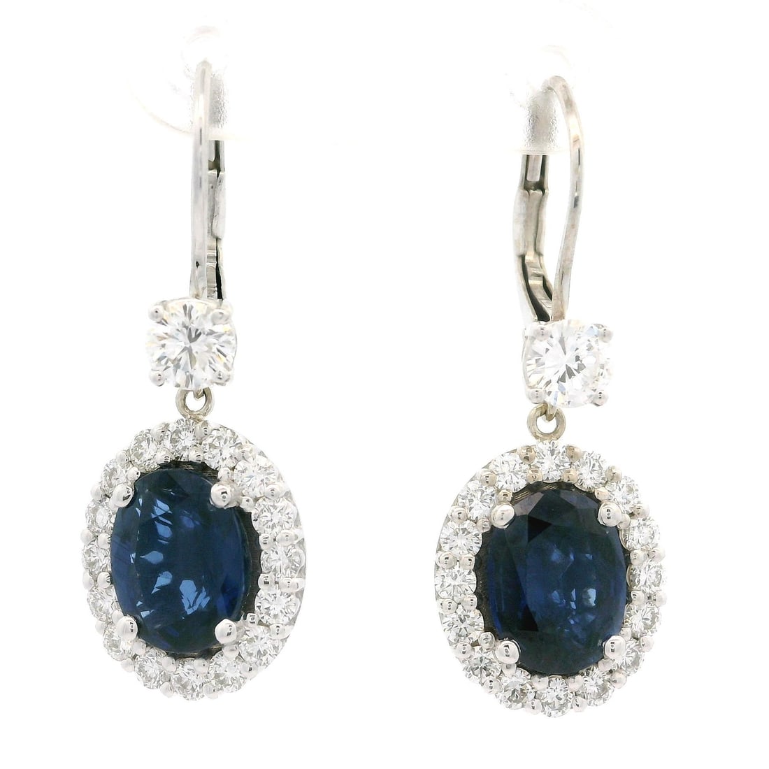18k White Gold GIA Certified 5.55ct Oval Sapphire Diamond Dangle Earrings: 18k White Gold GIA Certified 5.55ct Oval Sapphire Diamond Dangle Earrings Elevate your elegance with these stunning drop dangle earrings crafted in solid 18k white gold. Featuring two natural oval-cut