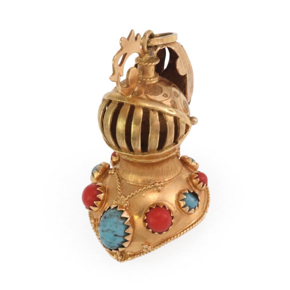 Vintage 18k Yellow Gold Knight Helmet Pendant with Coral and Turquoise: Vintage 18k Yellow Gold Knight Helmet Pendant with Coral and Turquoise This vintage knight's helmet pendant is a stunning piece crafted from 18k yellow gold. The unique design features a knight's