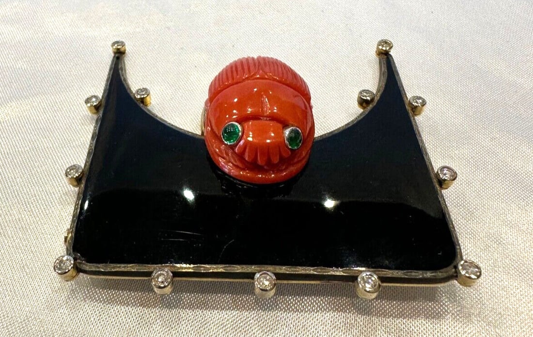 Austrian Art Deco 18K Gold Coral Scarab Brooch with Diamonds and Enamel: Austrian Art Deco 18K Gold Coral Scarab Brooch with Diamonds and Enamel Discover the beauty of this exquisite Austrian Art Deco brooch crafted from 18k gold, adorned with coral, diamonds, emeralds, an