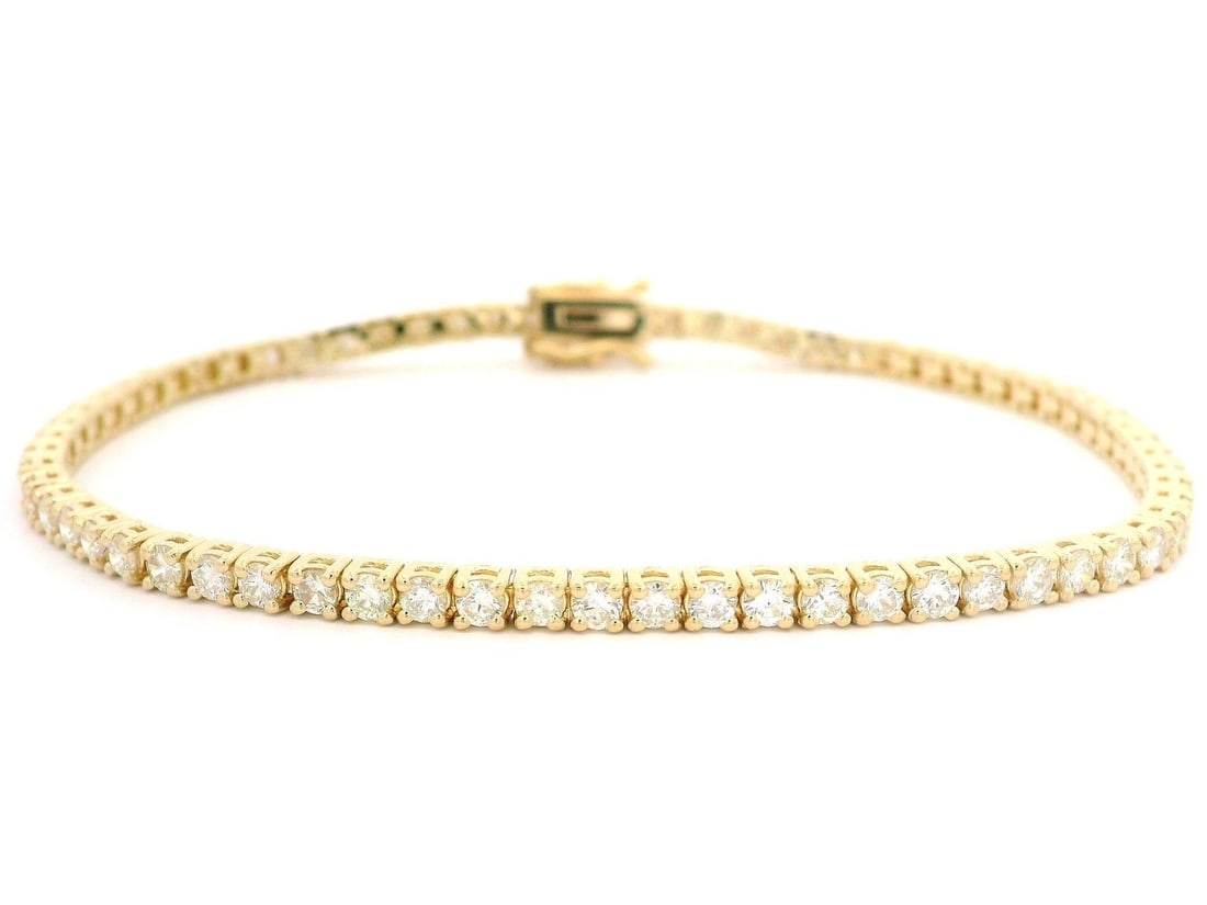 14k Yellow Gold 2.85ctw Diamond Tennis Link Bracelet Classic Style: 14k Yellow Gold 2.85ctw Diamond Tennis Link Bracelet Classic Style This exquisite classic line tennis bracelet features 68 natural round brilliant cut diamonds, totaling 2.85 carats. The diamonds are 