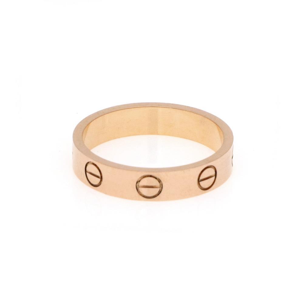 Cartier Mini Love 18k Rose Gold Band Ring US 4.5 with Certificate: Cartier Mini Love 18k Rose Gold Band Ring US 4.5 with Certificate Presenting a stunning band ring from Cartier's iconic LOVE collection, this piece is crafted from luxurious 18k rose gold and features