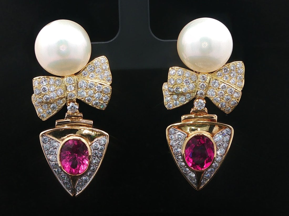 GIA Pink Tourmaline Pearl Diamond Yellow Gold Dangle Earrings: GIA Pink Tourmaline Pearl Diamond Yellow Gold Dangle Earrings These elegant dangle earrings feature vivid pink, oval-cut natural rubellite tourmalines, genuine cultured white pearls, and 132 round bri