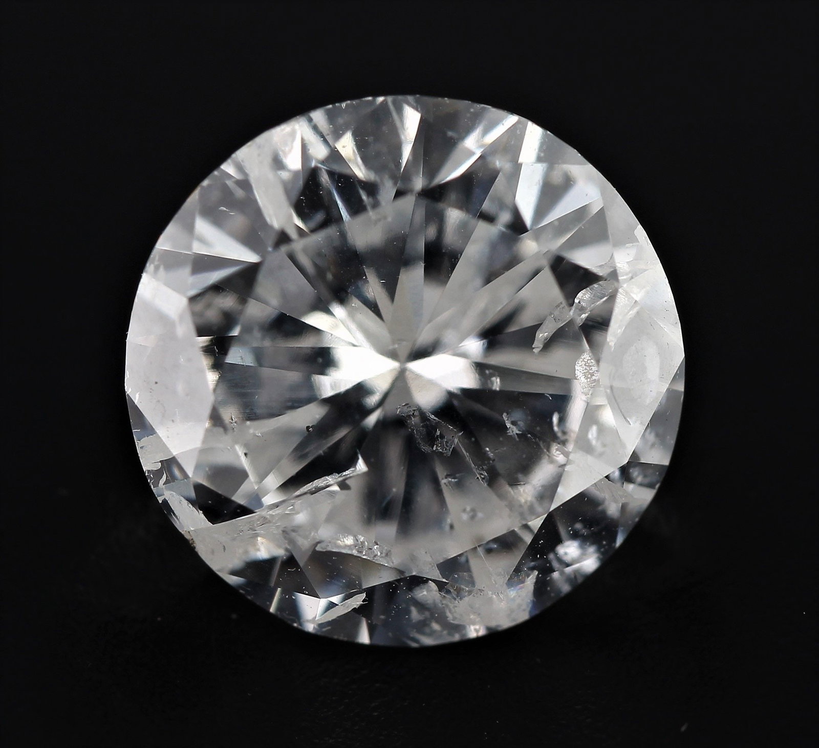Loose Diamond - ROUND 1.26ct E I1: Loose Diamond - ROUND 1.26ct E I1 Source: Natural Shape: ROUND Carats: 1.26 Color: E Clarity: I1 Certification: NONE The Diamond Depot Guarantee: All items in this auction are guaranteed to be 100% au