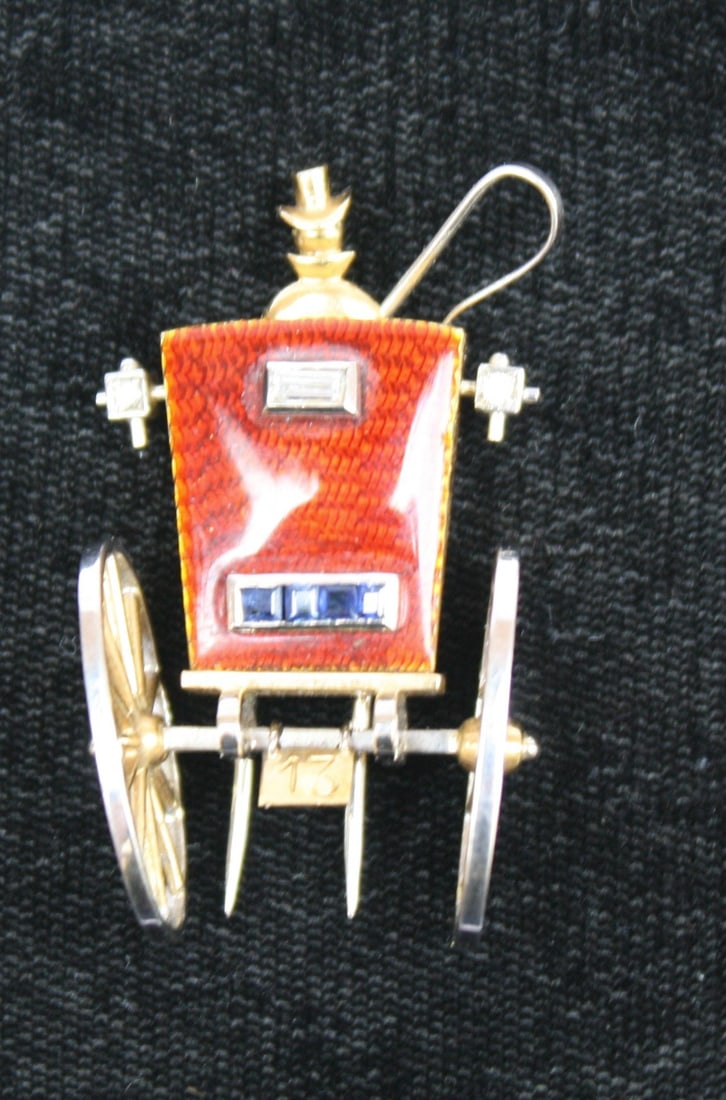 Paul Flato Art Deco 18K Gold Diamond Sapphire Carriage Brooch: Paul Flato Art Deco 18K Gold Diamond Sapphire Carriage Brooch This exquisite Art Deco brooch, crafted by Paul Flato in the 1930s, showcases a stunning carriage design made from 18K yellow and white go