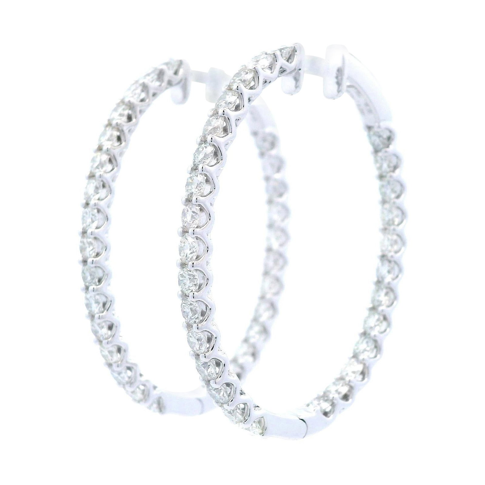 Contemporary 4.33 Carat Round Diamond Hoop Earrings in 14k White Gold: Contemporary 4.33 Carat Round Diamond Hoop Earrings in 14k White Gold These stunning contemporary hoop earrings feature 56 round brilliant diamonds, totaling 4.33 carats, beautifully set in 14k white 