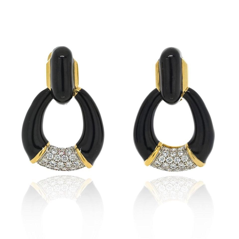 Black Enamel Diamond Door Knocker Earrings in Platinum and 18K Gold by David Webb: Black Enamel Diamond Door Knocker Earrings in Platinum and 18K Gold by David Webb These David Webb door knocker earrings feature a striking design crafted from platinum and 18K yellow gold. The earrin