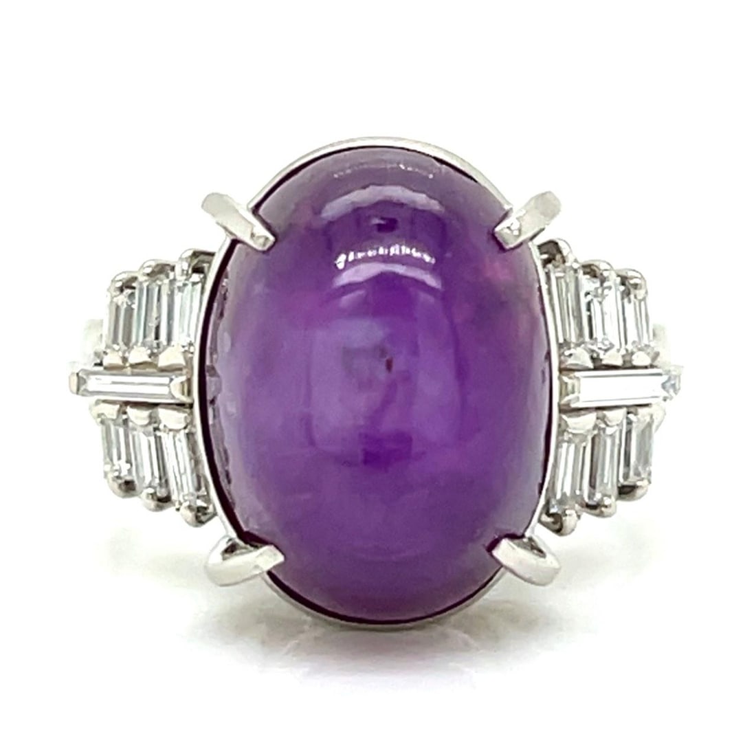 15.44 Carat Star Ruby Ring with Diamond Baguettes in Platinum: 15.44 Carat Star Ruby Ring with Diamond Baguettes in Platinum This platinum ring features a striking 15.44 carat star ruby as its centerpiece, accented by 12 baguette diamonds totaling 0.41 carats wit