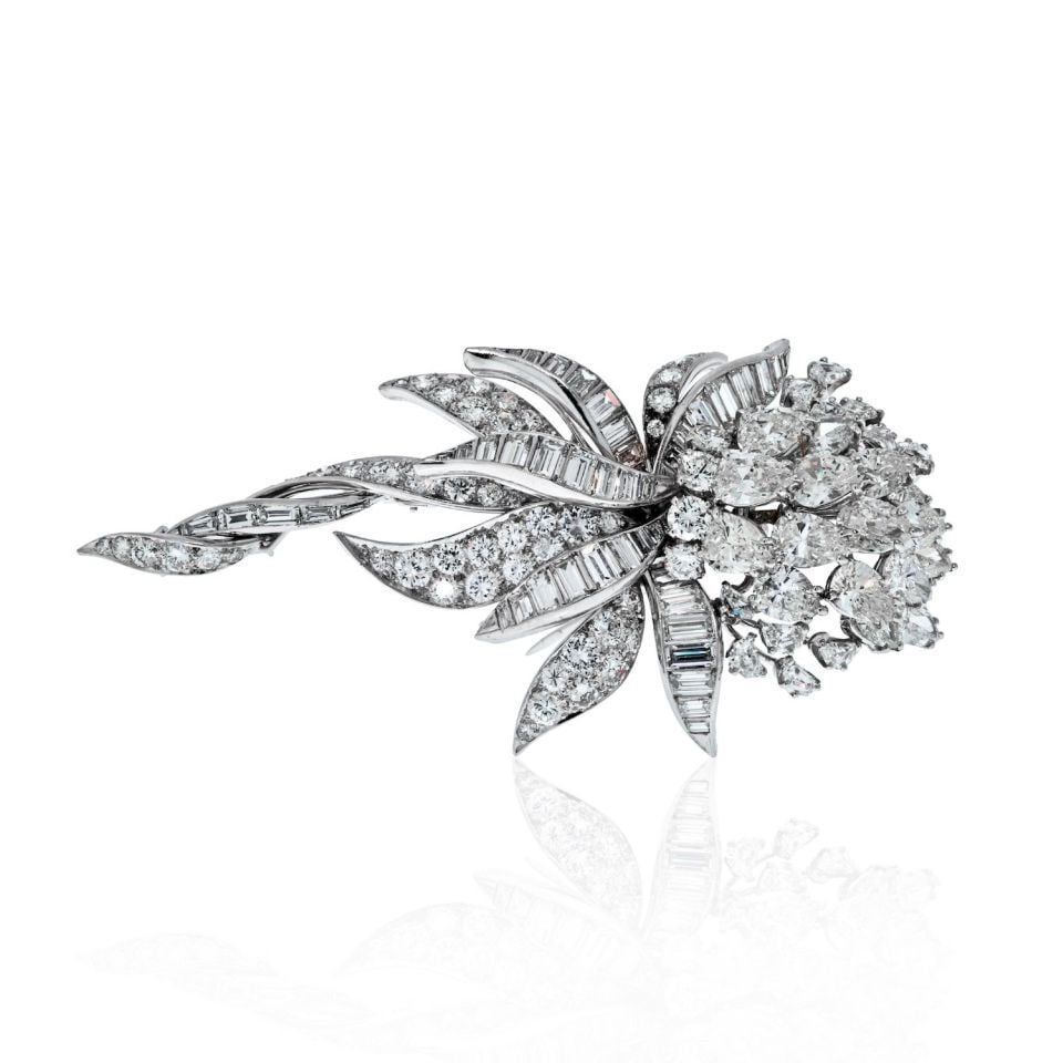 David Webb 1960s Platinum Diamond Floral Brooch 21 Carats: David Webb 1960s Platinum Diamond Floral Brooch 21 Carats This exquisite brooch by David Webb, crafted in luxurious platinum, features a stunning array of mixed cut diamonds, including round brilliant