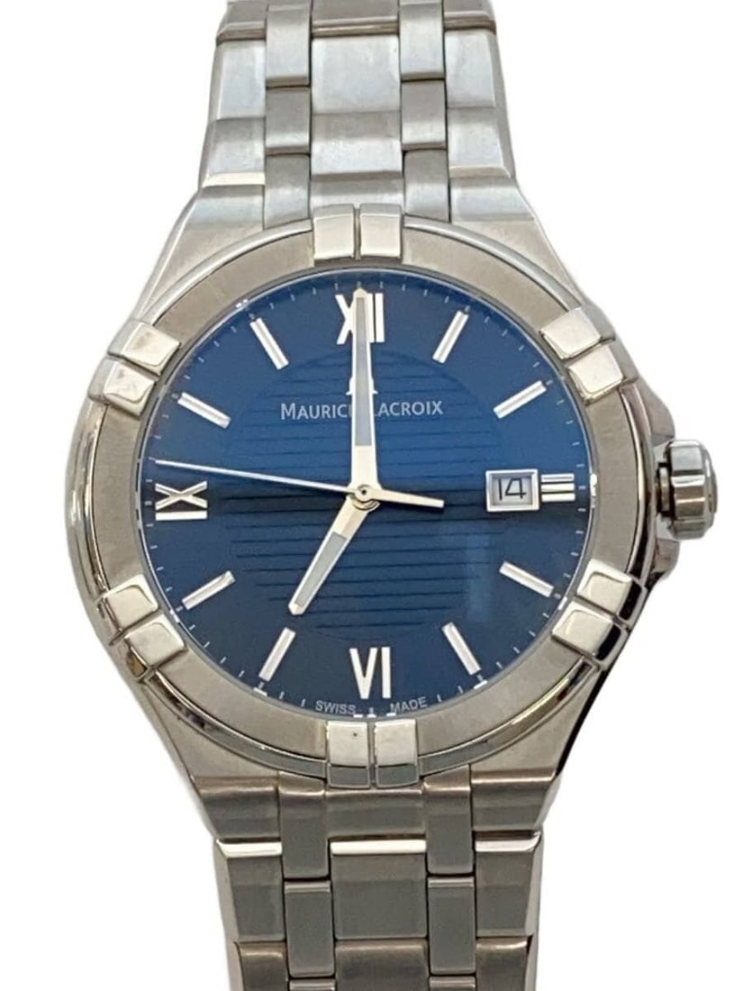 Maurice Lacroix Aikon Date Quartz Black Men's Wristwatch: Maurice Lacroix Aikon Date Quartz Black Men's Wristwatch This Maurice Lacroix Aikon Date Quartz AI1008 men's wristwatch features a black dial and a Swiss-made quartz movement. The watch is pre-owned a
