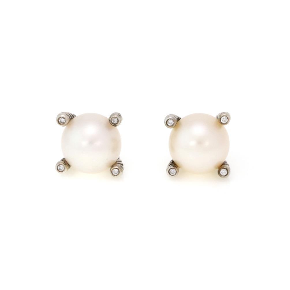 David Yurman Sterling Silver Pearl Stud Earrings with Diamond Accents: David Yurman Sterling Silver Pearl Stud Earrings with Diamond Accents Elevate your jewelry collection with these exquisite David Yurman Pearl Stud Earrings. Crafted from high-quality sterling silver, 