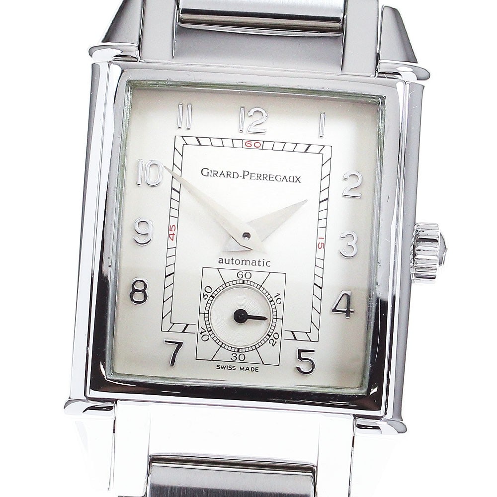 Girard Perregaux Vintage 1945 Automatic Steel Wristwatch 2593: Girard Perregaux Vintage 1945 Automatic Steel Wristwatch 2593 This pre-owned Girard Perregaux Vintage 1945 men's wristwatch features a stainless steel case and bracelet, complemented by a beige dial. 