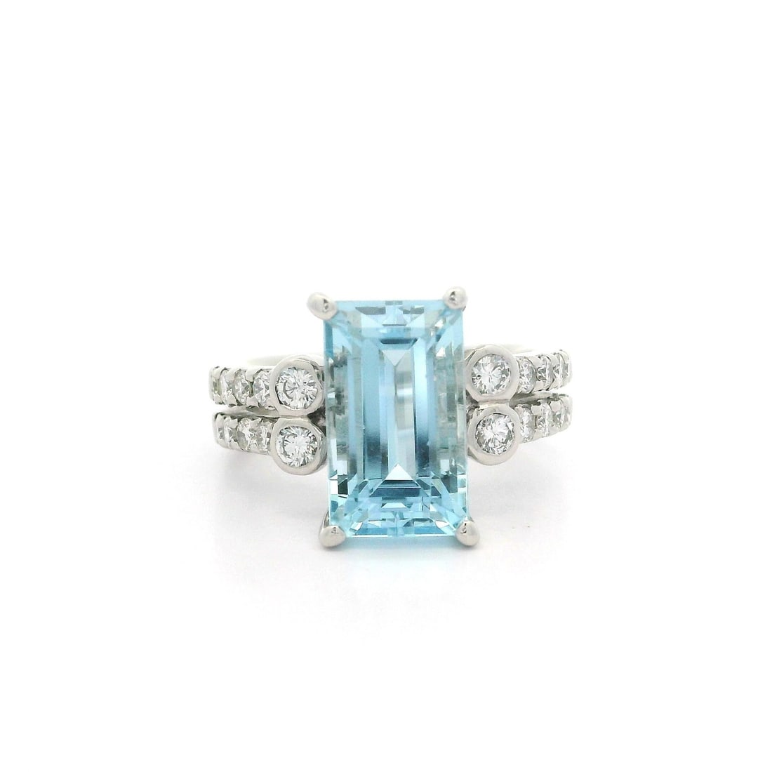 Platinum 4.09ct Aquamarine & Diamond Split Shank Cocktail Ring: Platinum 4.09ct Aquamarine & Diamond Split Shank Cocktail Ring This stunning cocktail ring features a long emerald cut natural aquamarine, elegantly prong set to showcase its beautiful blue color. The