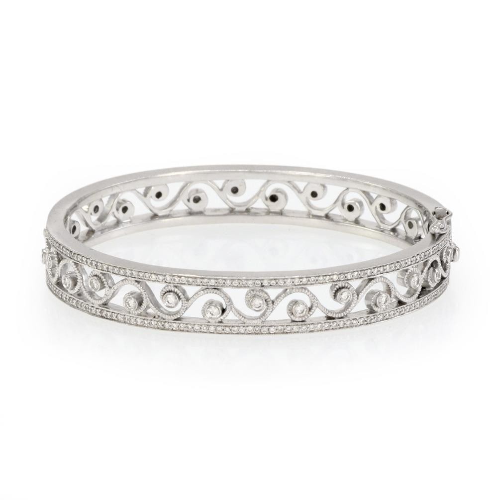 18k White Gold Diamond Bangle Bracelet with Milgrain Scroll Design: 18k White Gold Diamond Bangle Bracelet with Milgrain Scroll Design This exquisite wide hinged oval bangle bracelet is made of 18k white gold, showcasing a stunning open design that measures 9mm in wid