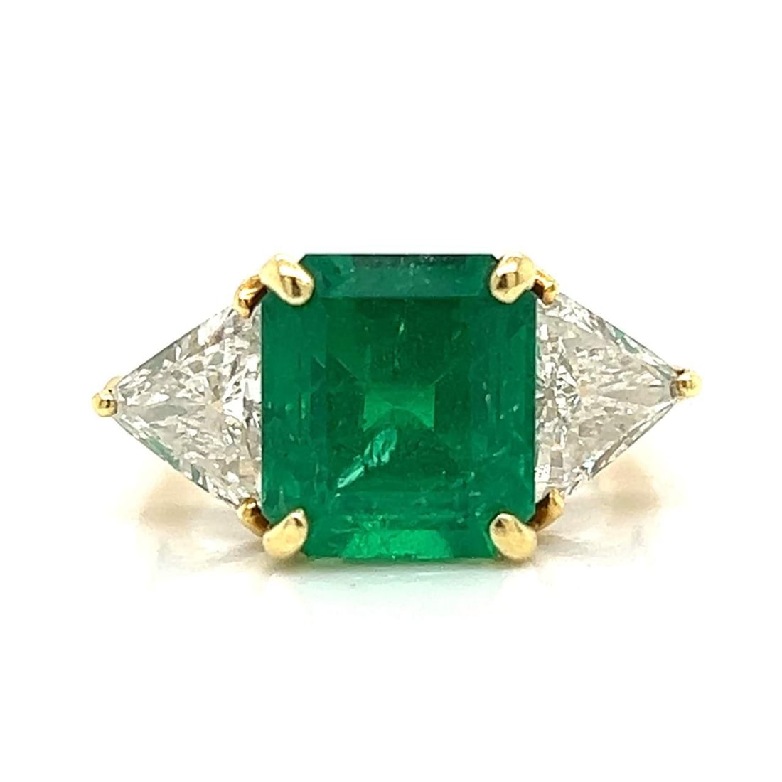 18K Yellow Gold 5.10 Ct Colombian Emerald Diamond Ring: 18K Yellow Gold 5.10 Ct Colombian Emerald Diamond Ring This exquisite ring is crafted from 18K yellow gold and features a stunning 5.10 Ct. Colombian emerald at its center, measuring approximately 10.
