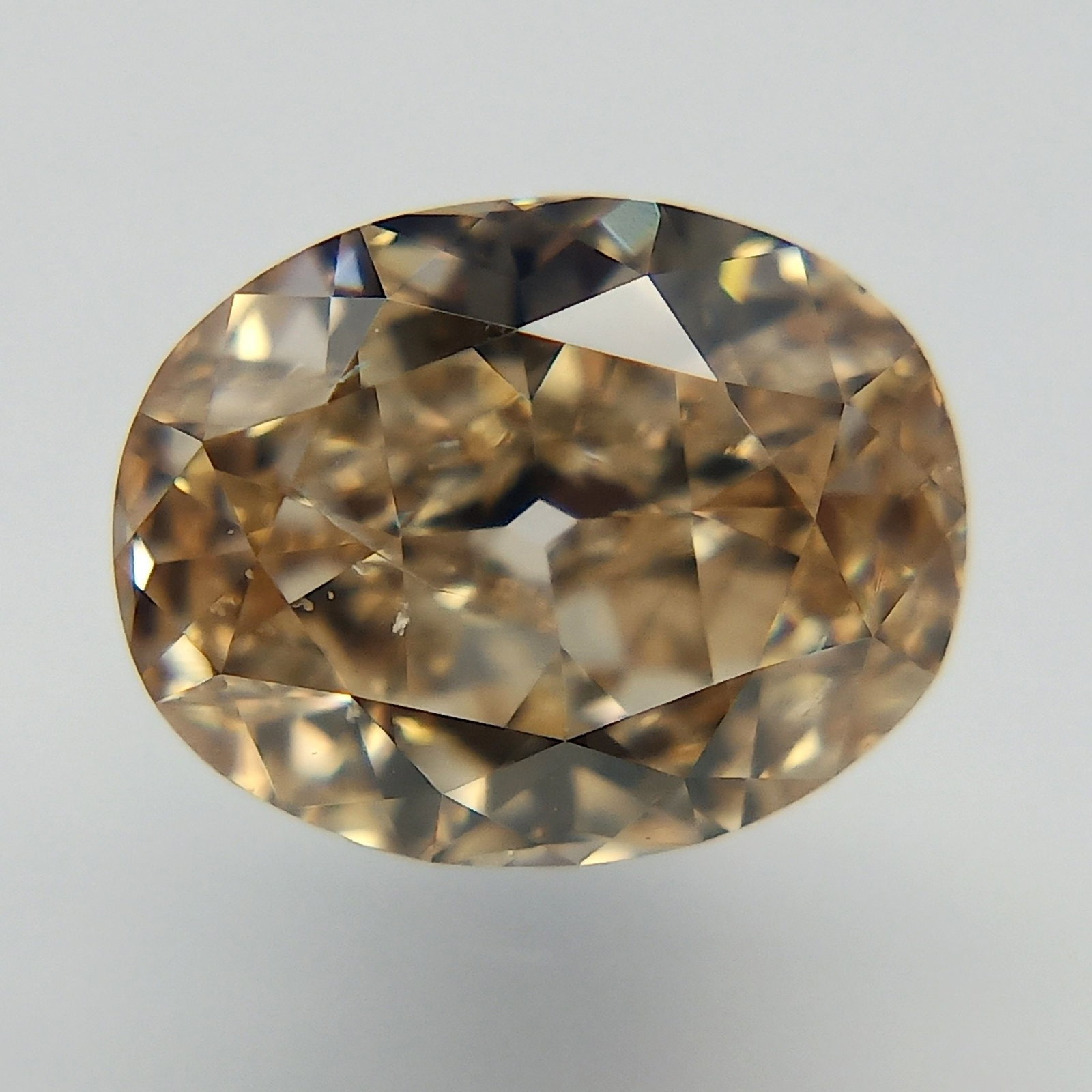 Loose Diamond - OVAL 0.72ct Fancy Orange Brown SI2: Loose Diamond - OVAL 0.72ct Fancy Orange Brown SI2 Source: Natural Shape: OVAL Carats: 0.72 Color: Fancy Orange Brown Certification: GIA The Diamond Depot Guarantee: All items in this auction are guar