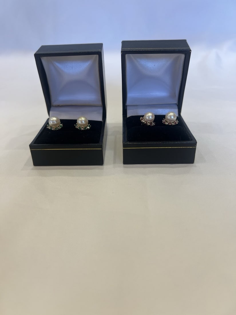 14k Gold Stud Earrings Two Pairs with Diamond Ruby Emerald Pearl: 14k Gold Stud Earrings Two Pairs with Diamond Ruby Emerald Pearl This listing includes two pairs of stud earrings crafted from 14k gold and featuring diamonds, rubies, emeralds, and pearls. Each earri
