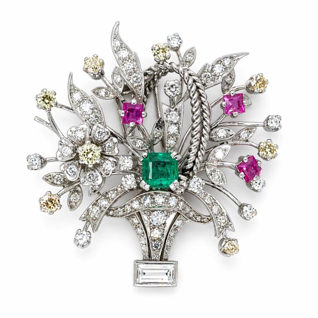 Art Deco Platinum Brooch with Diamonds Emerald and Rubies by Walser Wald: Art Deco Platinum Brooch with Diamonds Emerald and Rubies by Walser Wald This Art Deco brooch by Walser Wald is crafted in platinum and features a central emerald of approximately 1.40 carats. The pie
