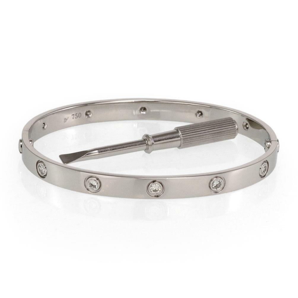 Cartier Love 18k White Gold Diamond Bangle Size 19 With Box Screwdriver: Cartier Love 18k White Gold Diamond Bangle Size 19 With Box Screwdriver This Cartier Love bangle from the Classic collection is crafted in 18k white gold with a high-polished finish. The elegant desig